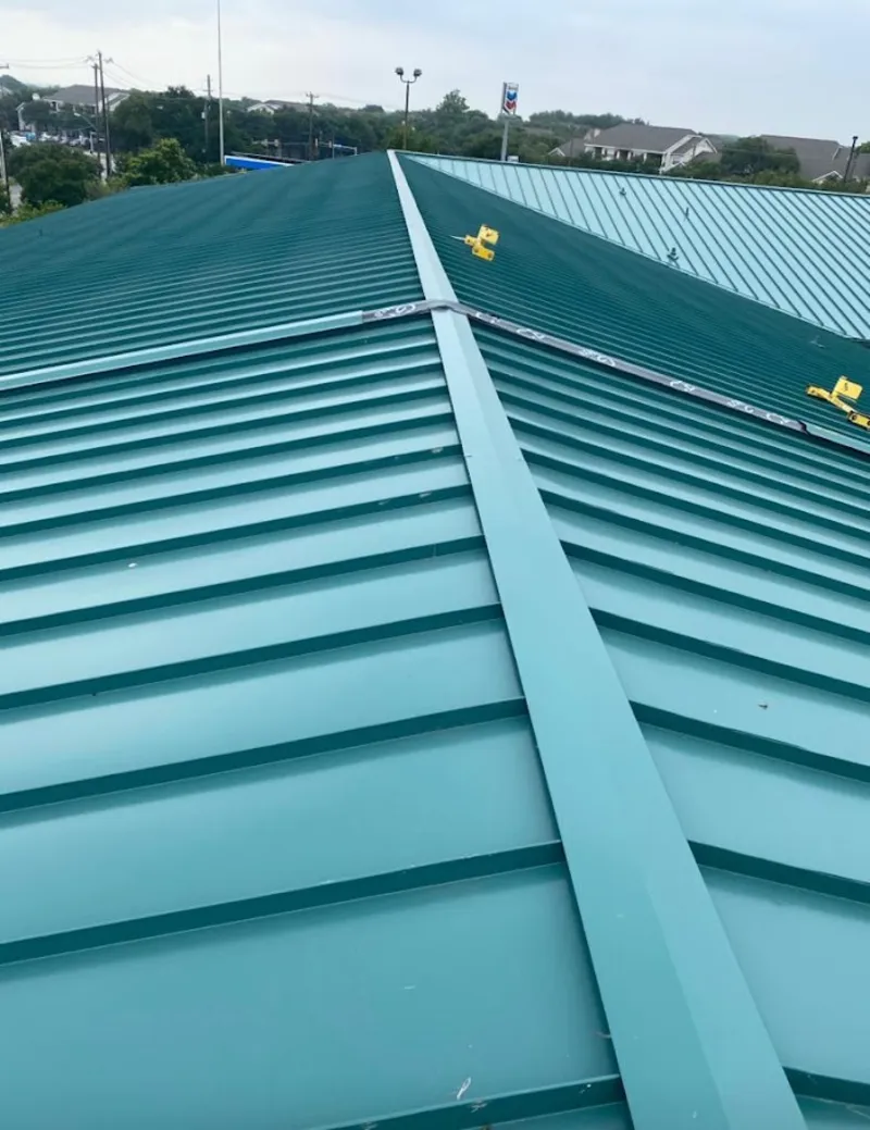 Green commercial metal roof ridge and valley for Metal Roof Repair in Dripping Springs